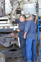 UCE Service Techs Jorge and José diagnosing a customer's truck