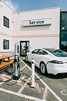 Service Drive customer entrance with EV charging station in the foreground.