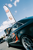 Prestige Imports POWERHAUS race car at car show.