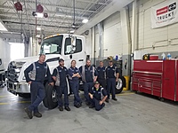 Our Medium Duty Technicians taking a picture for our Exclusive Hino Honors in our Medium Duty Shop 