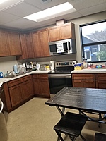 Employee kitchen, fully equipped with Range, microwave and large fridge. Oh, and a dishwasher!