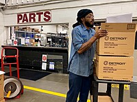 Delvin picking up his parts from the back parts counter. 