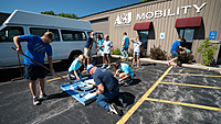Painting accessible parking spaces with our friends at BraunAbility.