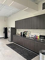 Employee and Technician Break Room complete with refrigerator, microwave, espresso machine and Keurig.