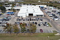 Birds eye view of parking lots for customers vehicles in for repairs 