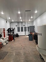 Tire room in new shop with new equipment including road force balancer, top of the line hunter tire machine and Genesis parts washer.